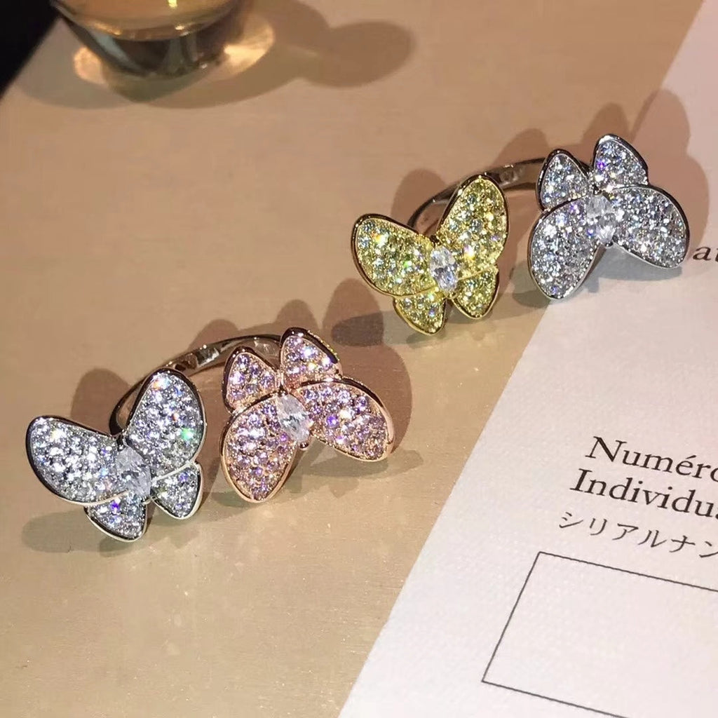 Two Butterfly Between The Finger Ring